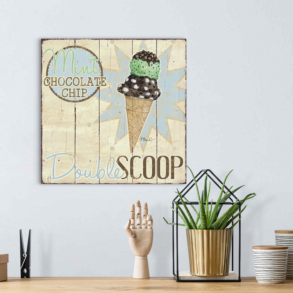 A bohemian room featuring A vintage ice cream shop sign featuring a double scoop on a cone.