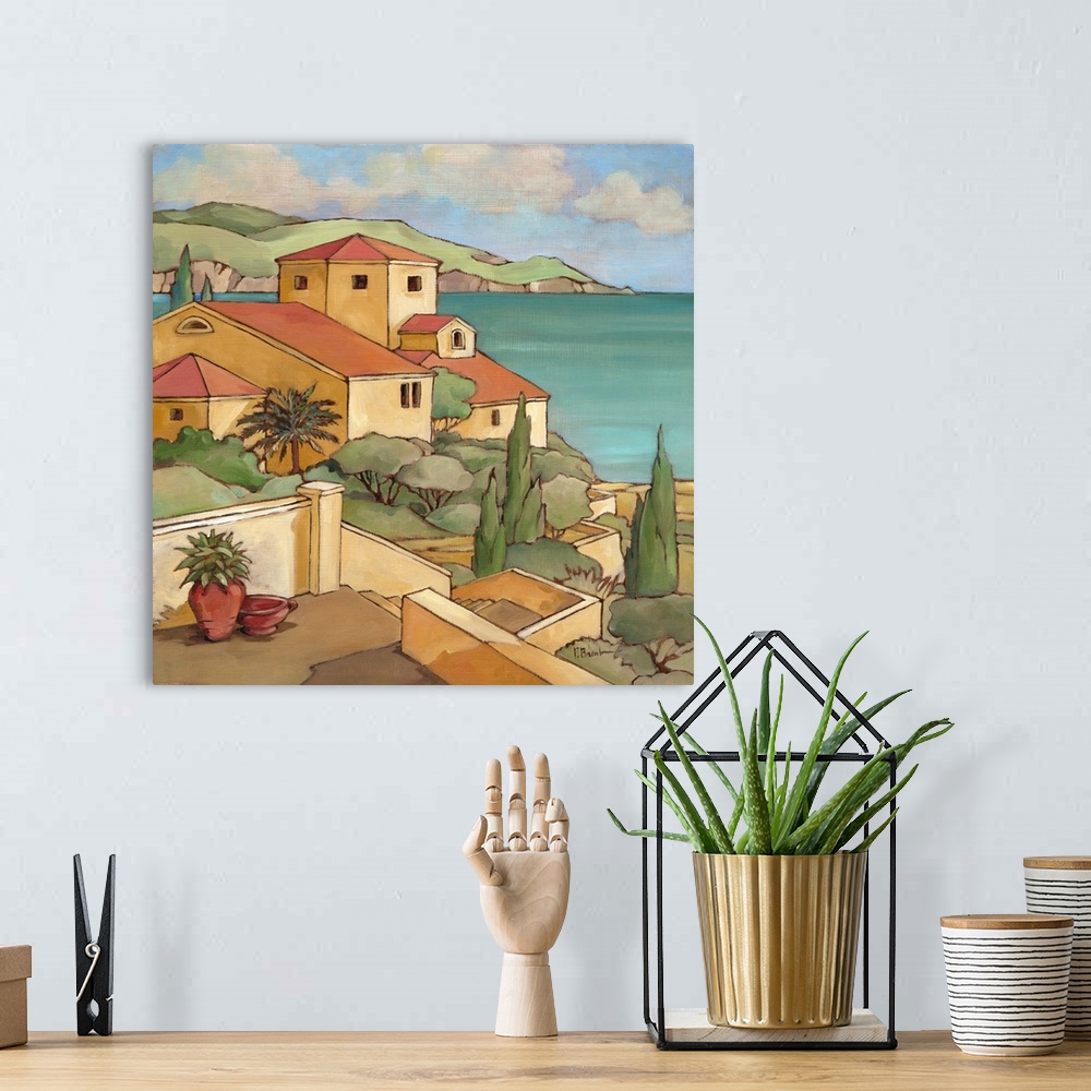A bohemian room featuring Painting of a Mediterranean town overlooking the sea.
