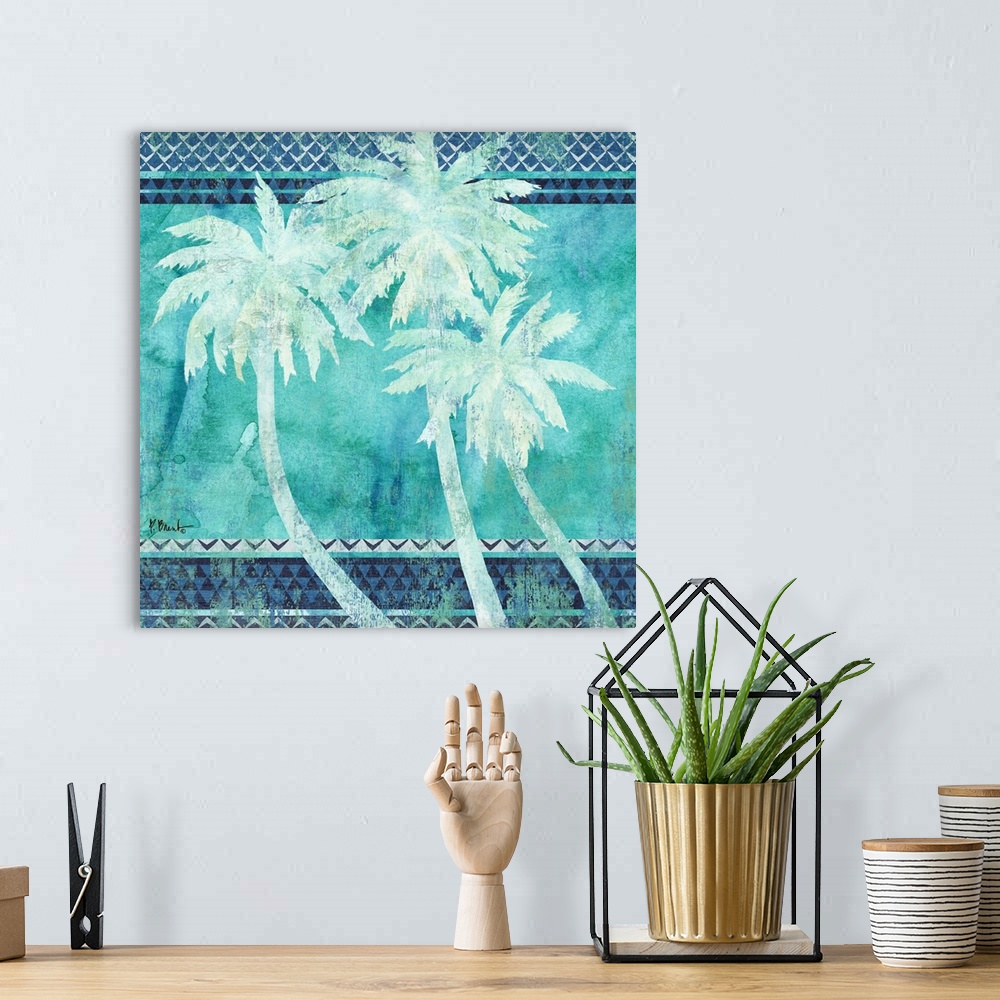 A bohemian room featuring Square decor with three silhouetted palm trees on a patterned background made in shades of blue.