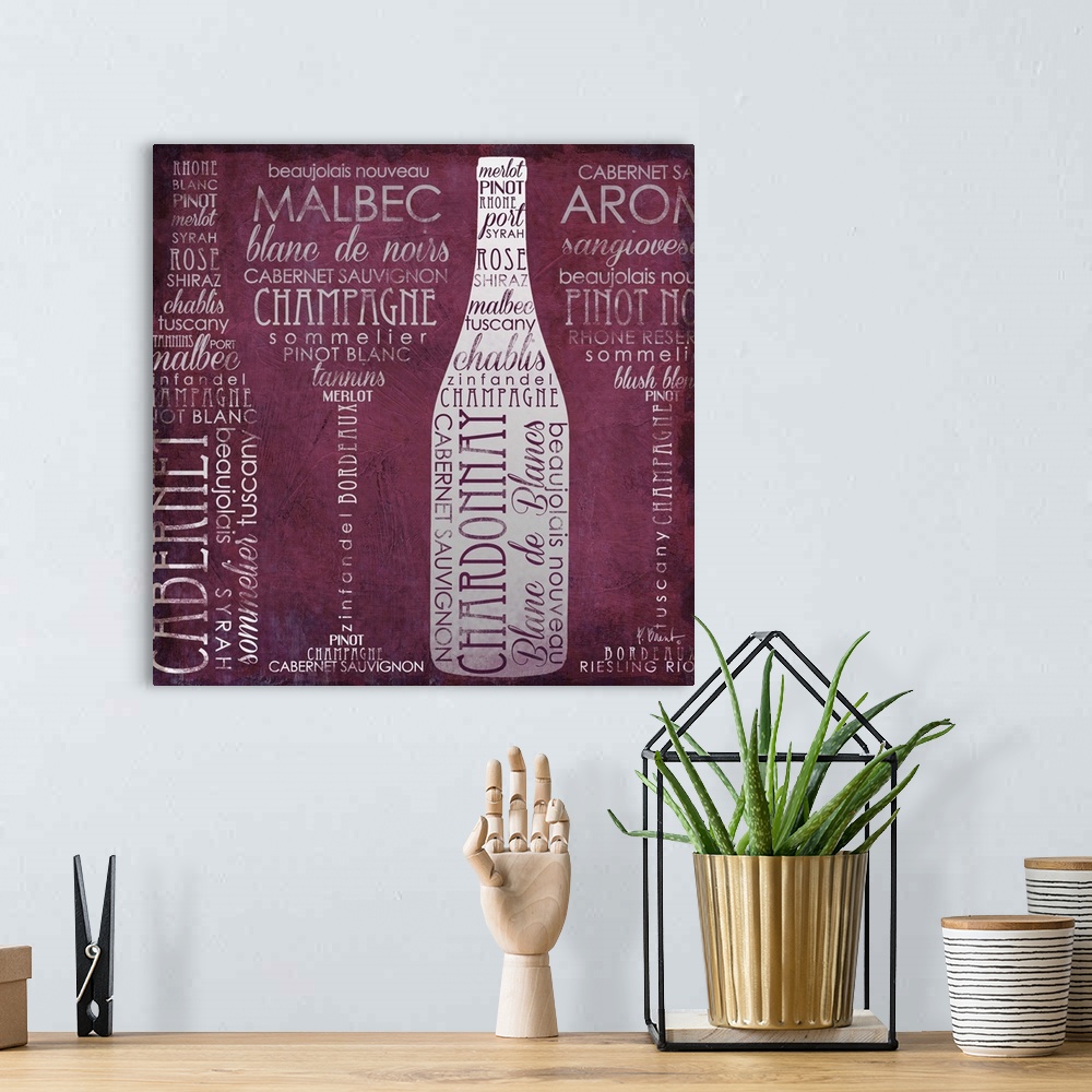 A bohemian room featuring Typography artwork of wine-themed words arranged to from wine bottles and glasses.