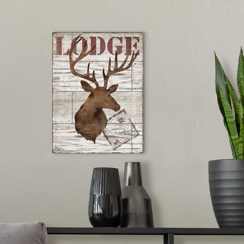 A modern room featuring Contemporary decorative artwork of a deer silhouette with the word "lodge" on a textured wooden b...