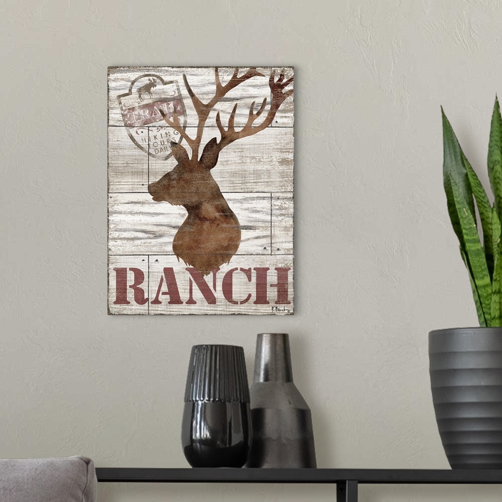A modern room featuring Contemporary decorative artwork of a deer silhouette with the word "ranch" on a textured wooden b...