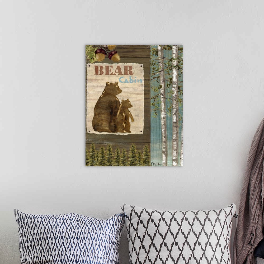 A bohemian room featuring Decorative artwork of forest elements such as a sign with bears, trees, and acorns.