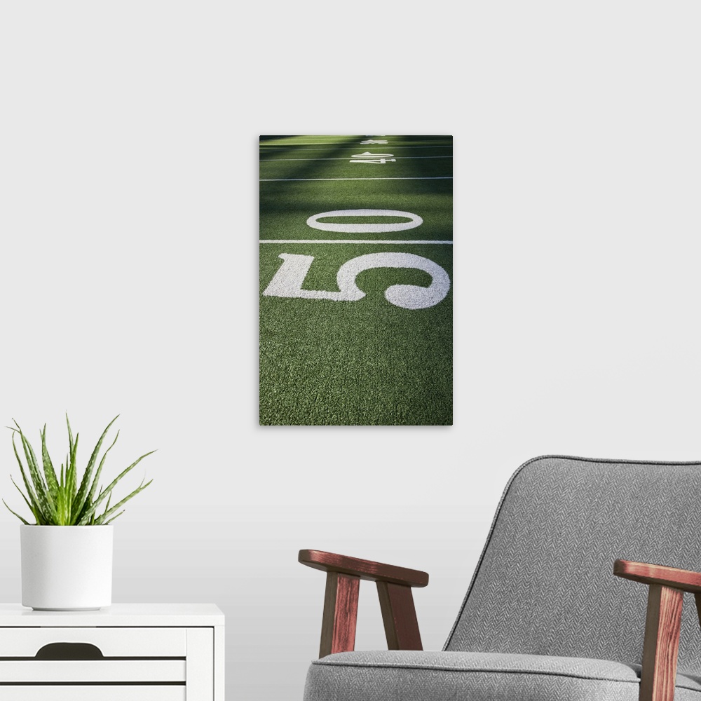 A modern room featuring 50 yard line marker in American Football stadium