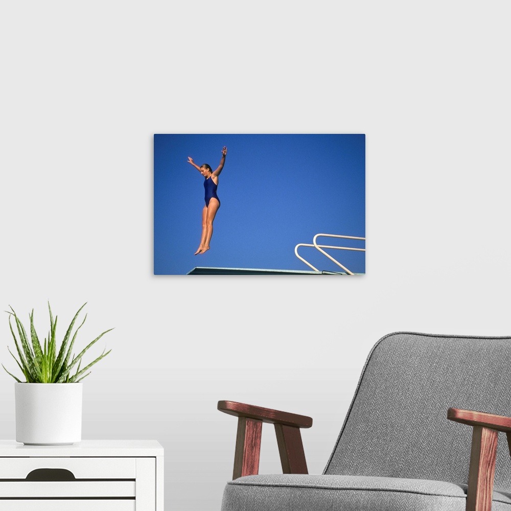 A modern room featuring Action of female diver