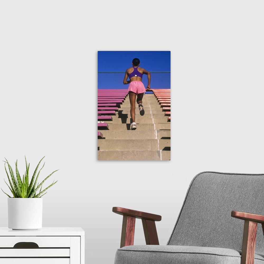 A modern room featuring Athletic woman running up stairs