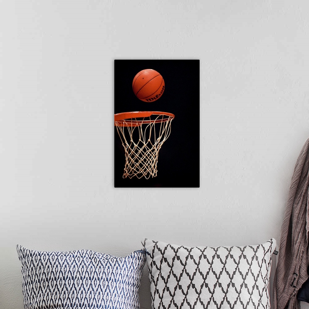 A bohemian room featuring Basketball going through the hoop