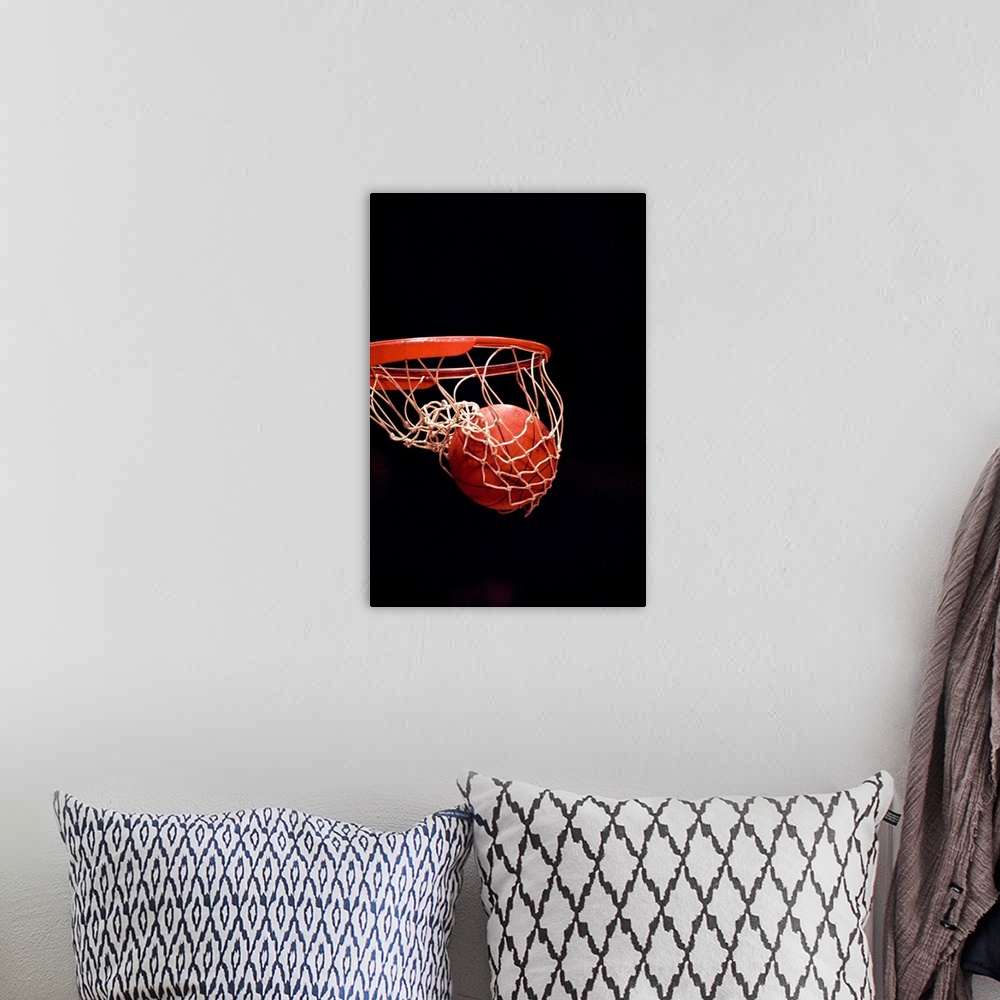 A bohemian room featuring Basketball going through the hoop