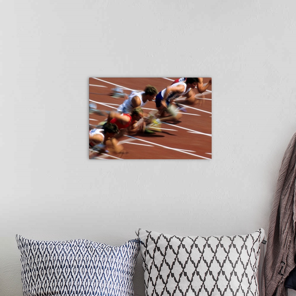 A bohemian room featuring Blurred action of men's 100 meter sprint race.
