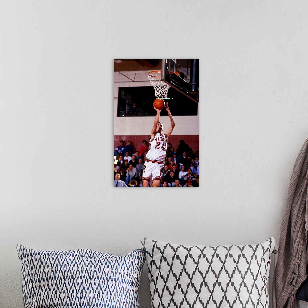 A bohemian room featuring Boys High School basketball player going up for a shot
