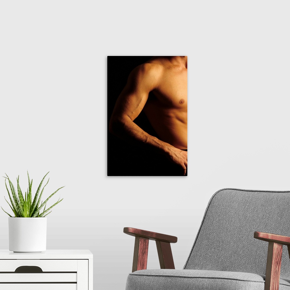 A modern room featuring Detail of male's arm and torso