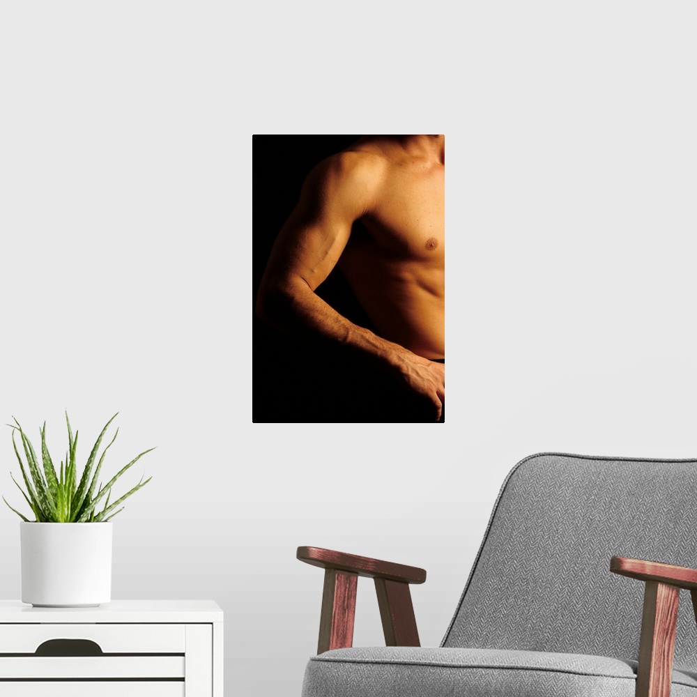 A modern room featuring Detail of male's arm and torso