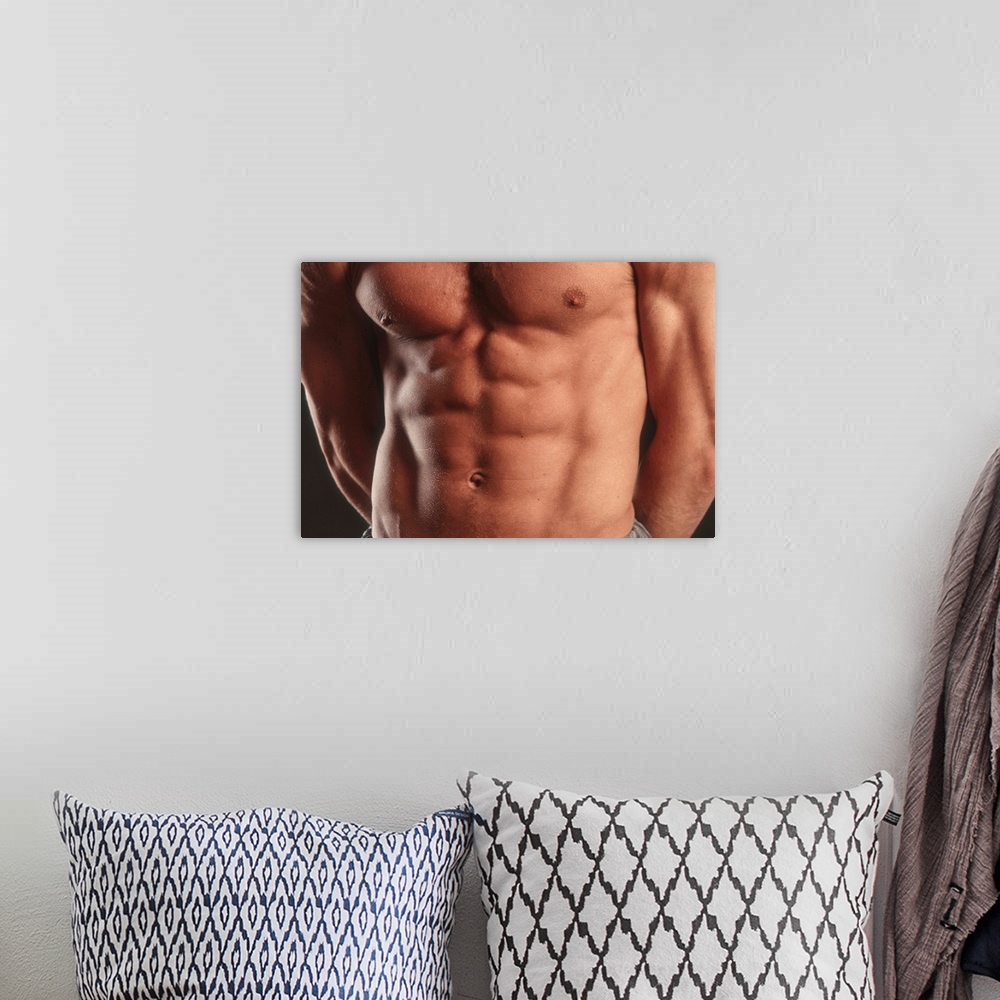 A bohemian room featuring Detail of male's torso.