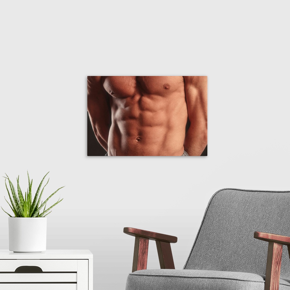 A modern room featuring Detail of male's torso.