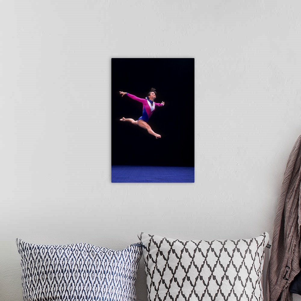 A bohemian room featuring Female gymnast on the floor exercise