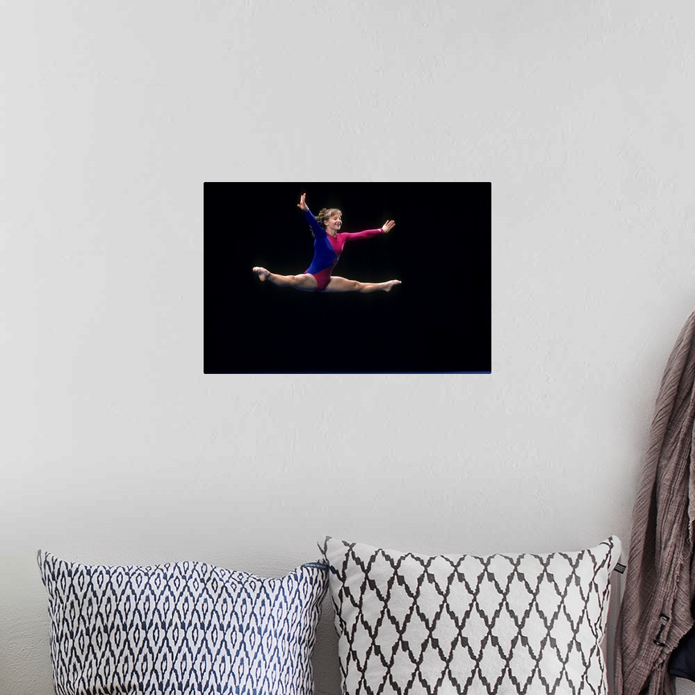 A bohemian room featuring Female gymnast on the floor exercise