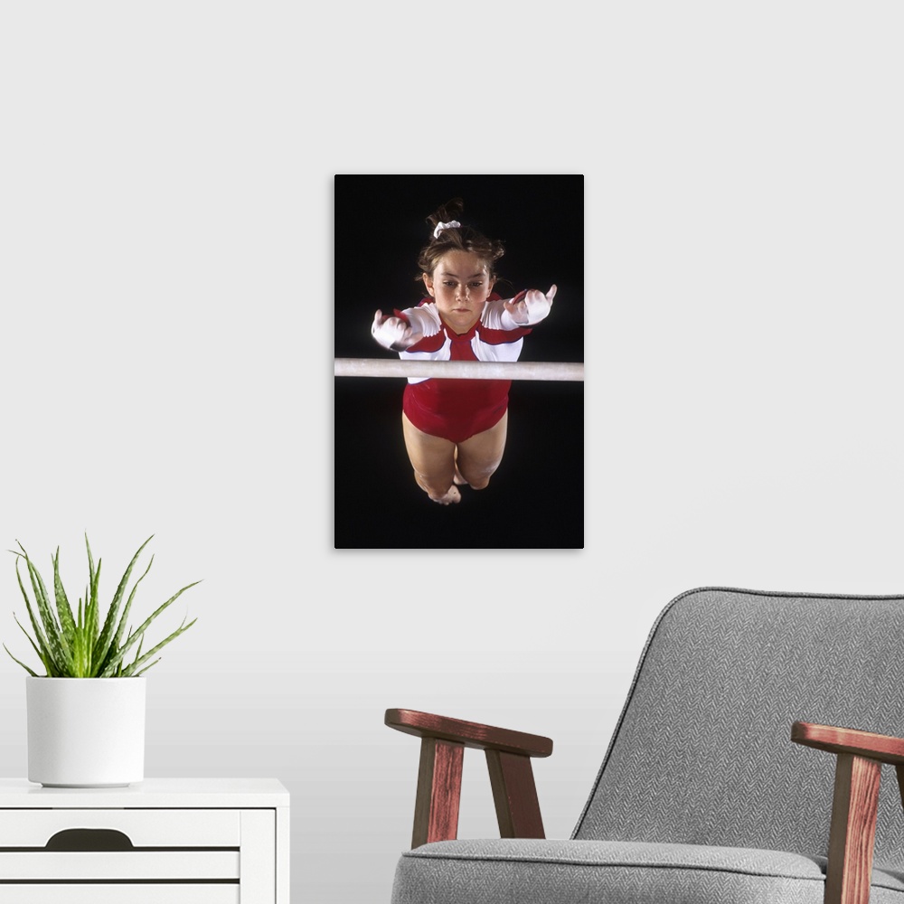 A modern room featuring Female gymnast on the uneven bars