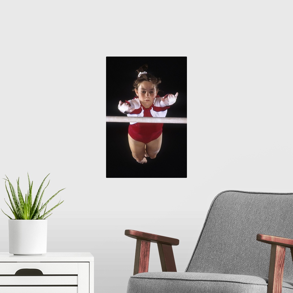 A modern room featuring Female gymnast on the uneven bars
