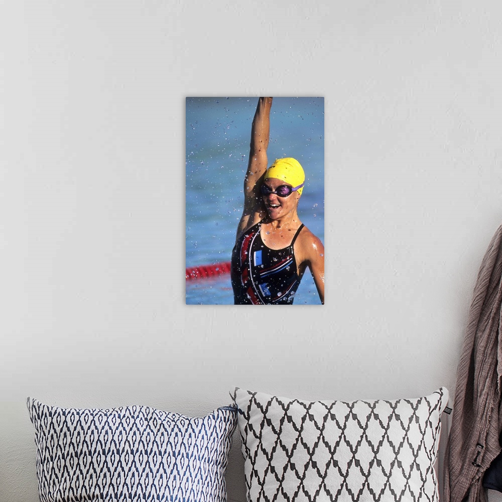 A bohemian room featuring Female swimmer reacts to victory
