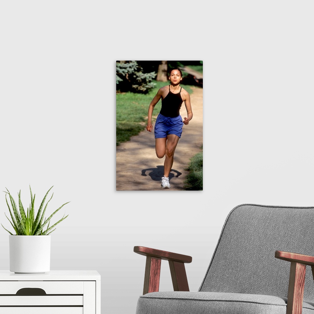 A modern room featuring Hispanic woman running for exercise