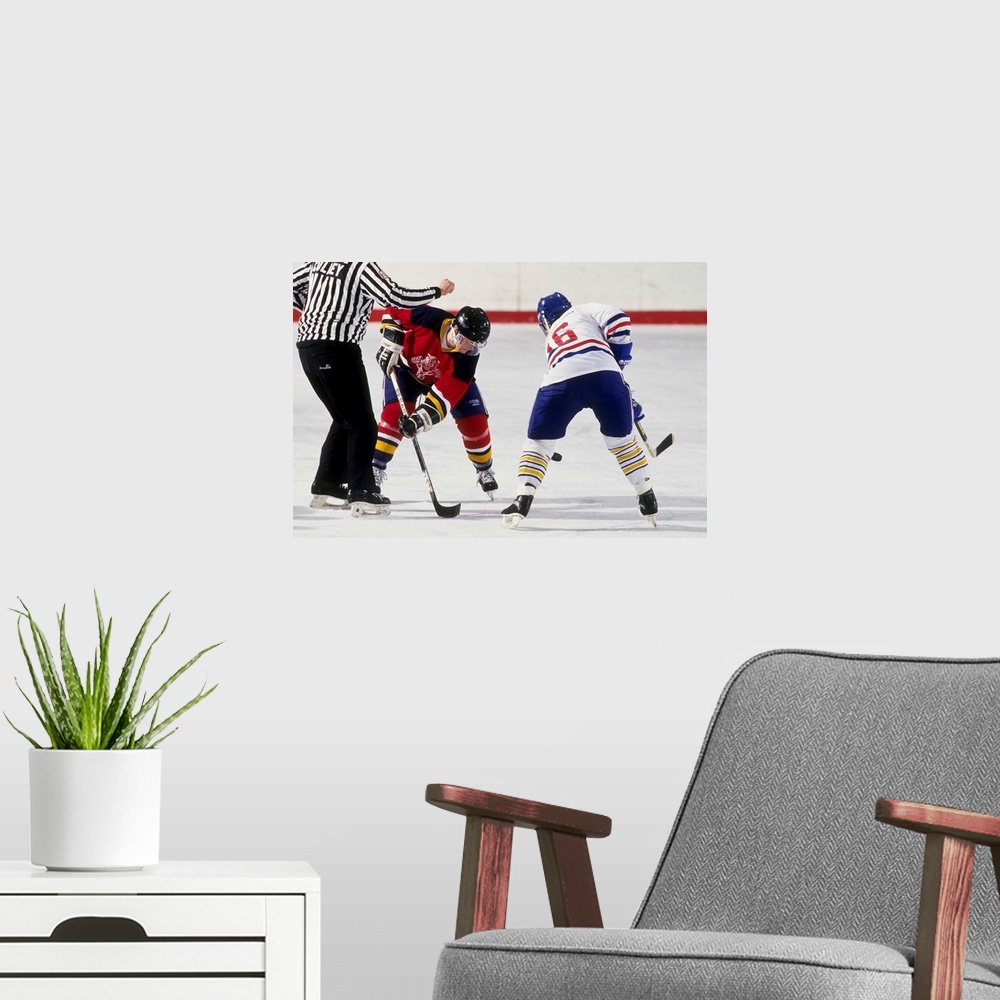 A modern room featuring Ice hockey face off