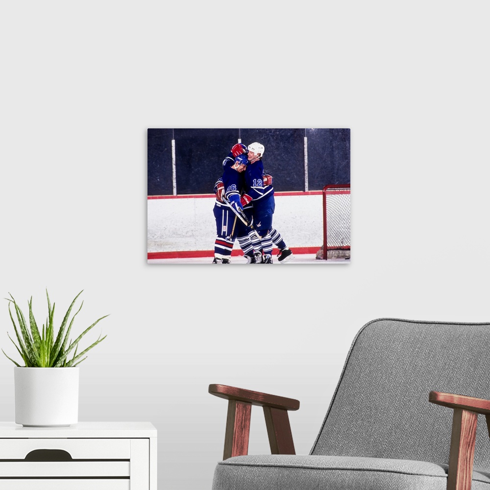 A modern room featuring Ice hockey players celebrate a goal
