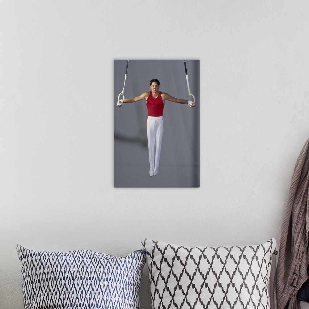 A bohemian room featuring Male gymnast on the rings