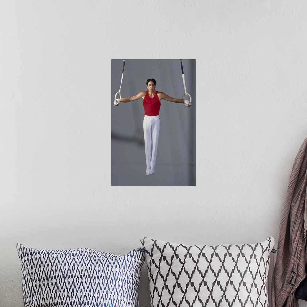 A bohemian room featuring Male gymnast on the rings