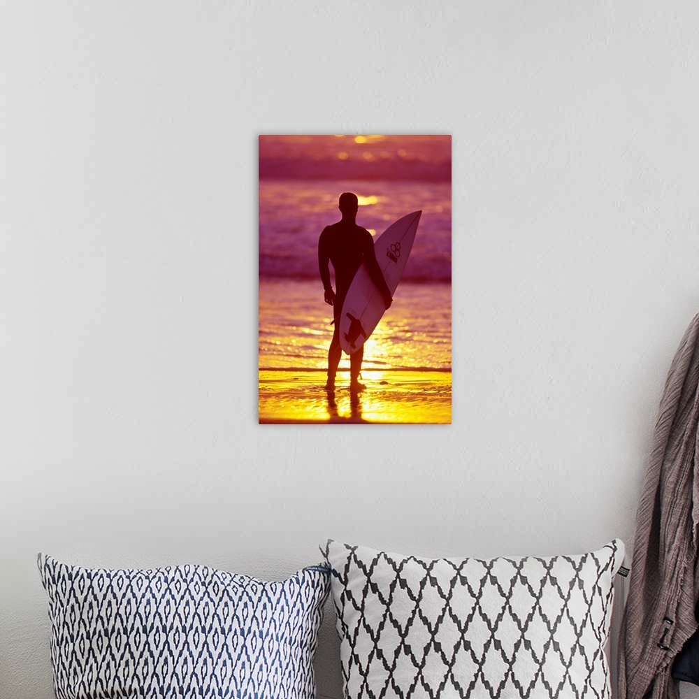 A bohemian room featuring Male surfer on a beach in San Diego, CA