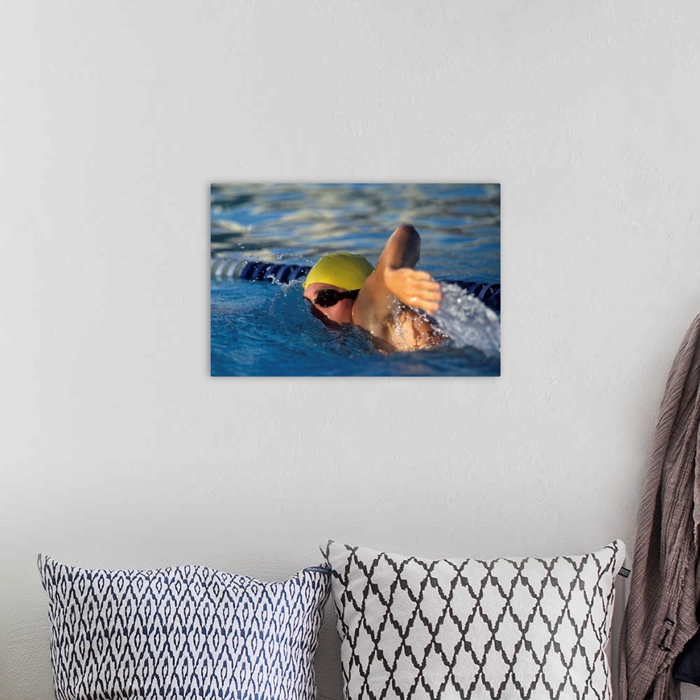 A bohemian room featuring Male swimmer in action