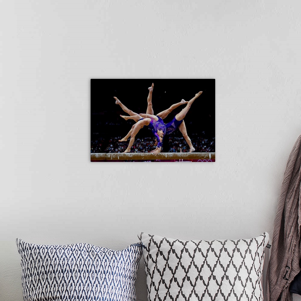 A bohemian room featuring Jordyn Wieber (USA) preforms on the balance bead during the women's team qualifying at the 2012 O...