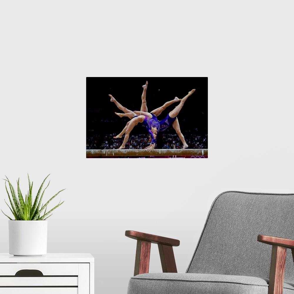 A modern room featuring Jordyn Wieber (USA) preforms on the balance bead during the women's team qualifying at the 2012 O...