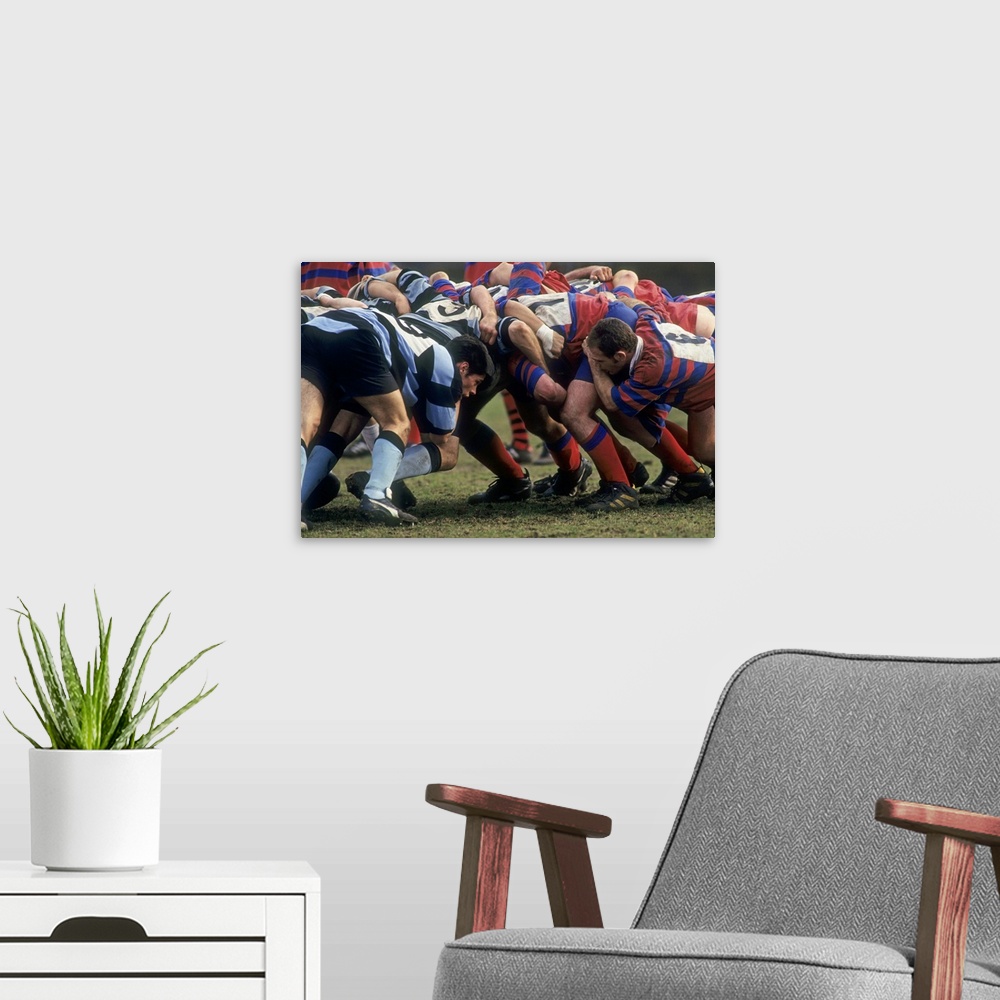 A modern room featuring Rugby match action