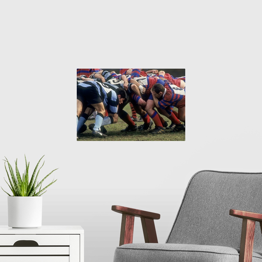 A modern room featuring Rugby match action