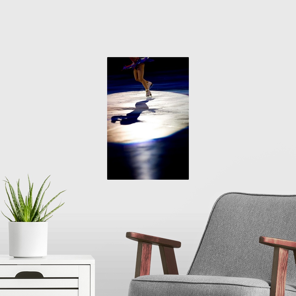 A modern room featuring Shadow of female figure skater in action