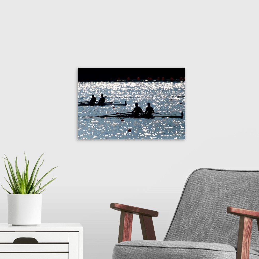 A modern room featuring Silhouette of men's pairs rowing teams in action