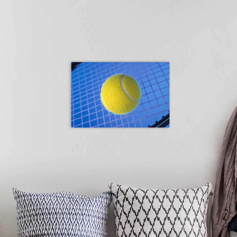 A bohemian room featuring Tennis ball on racquet