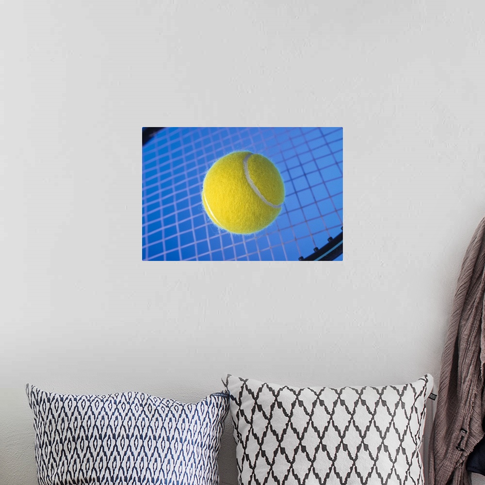A bohemian room featuring Tennis ball on racquet