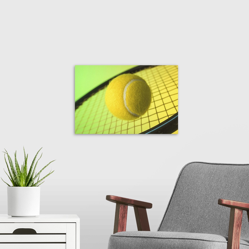 A modern room featuring Tennis ball on racquet