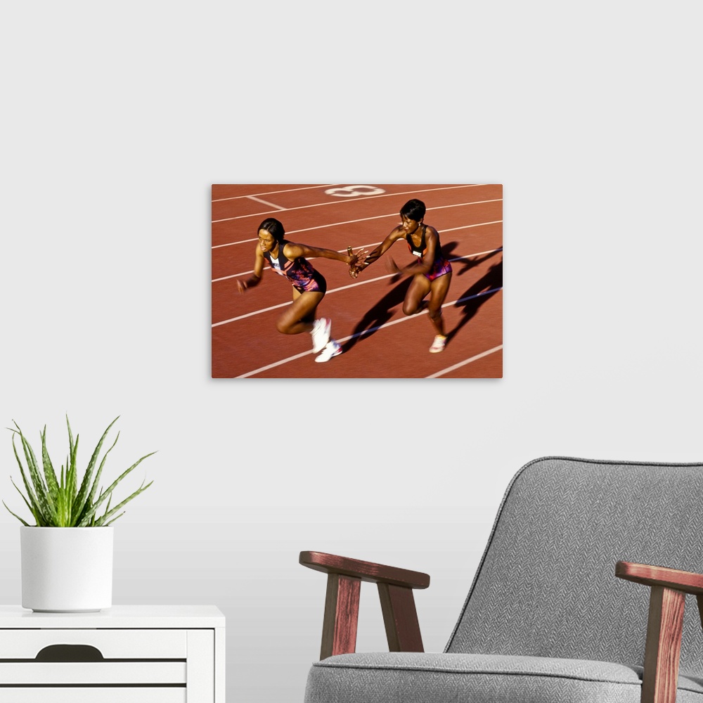 A modern room featuring Track and field relay baton pass