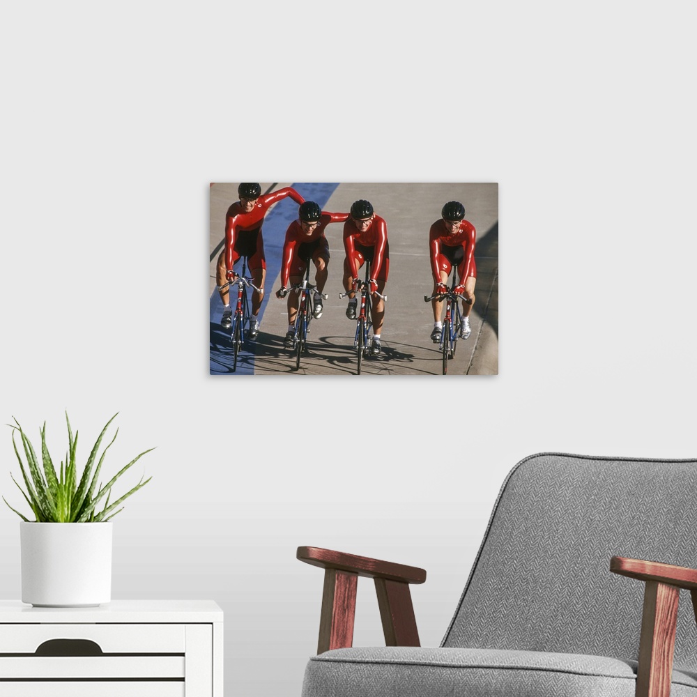 A modern room featuring Victorious male cycling team on the velodrome