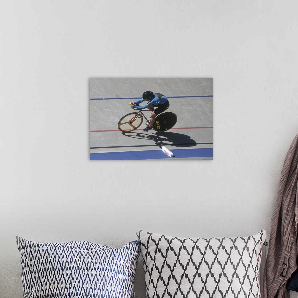 A bohemian room featuring Woman cyclist competing on the velodrome
