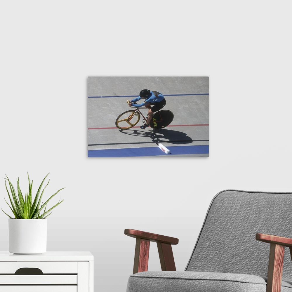 A modern room featuring Woman cyclist competing on the velodrome