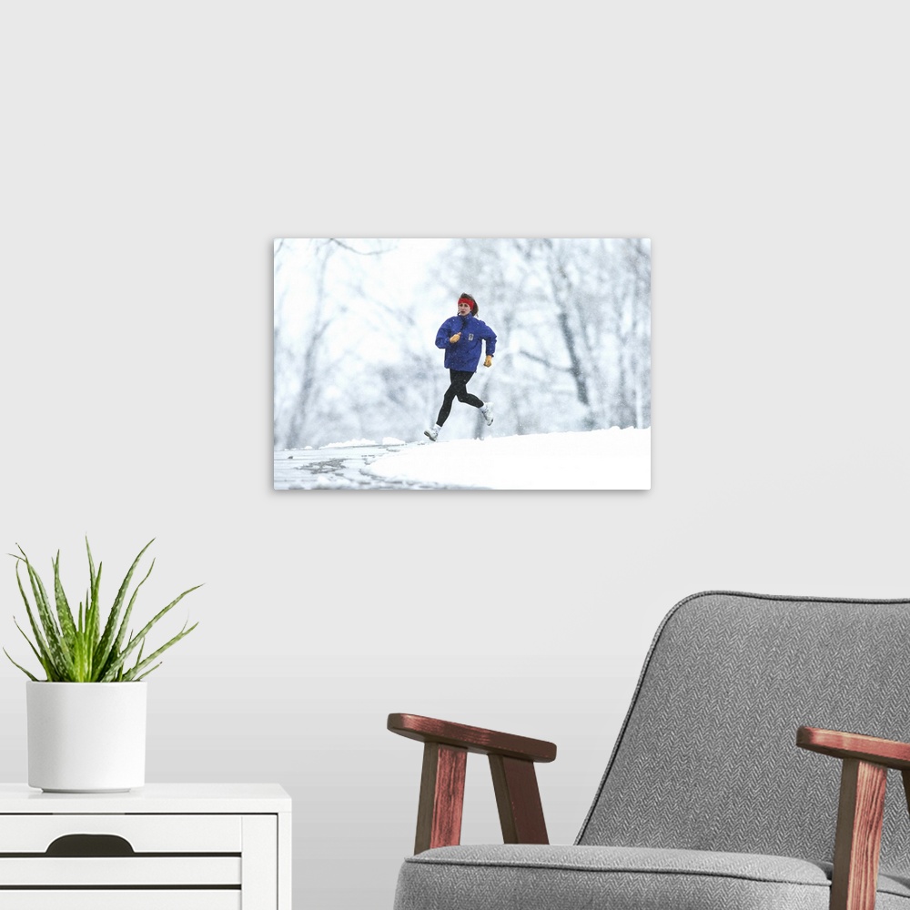 A modern room featuring Woman running outdoors in snowy weather