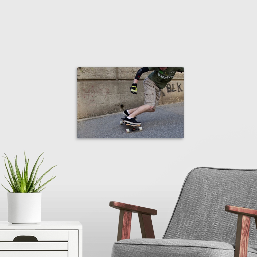 A modern room featuring Young male skateboarder on urban street