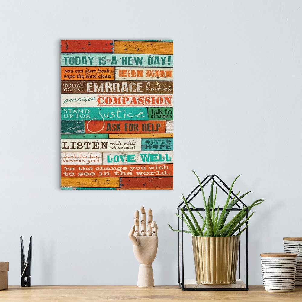 A bohemian room featuring Typography home decor art, with text in different fonts against a colorful wooden surface.