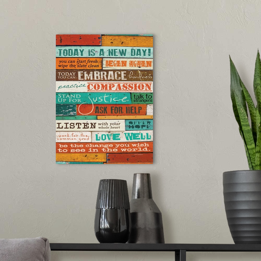 A modern room featuring Typography home decor art, with text in different fonts against a colorful wooden surface.
