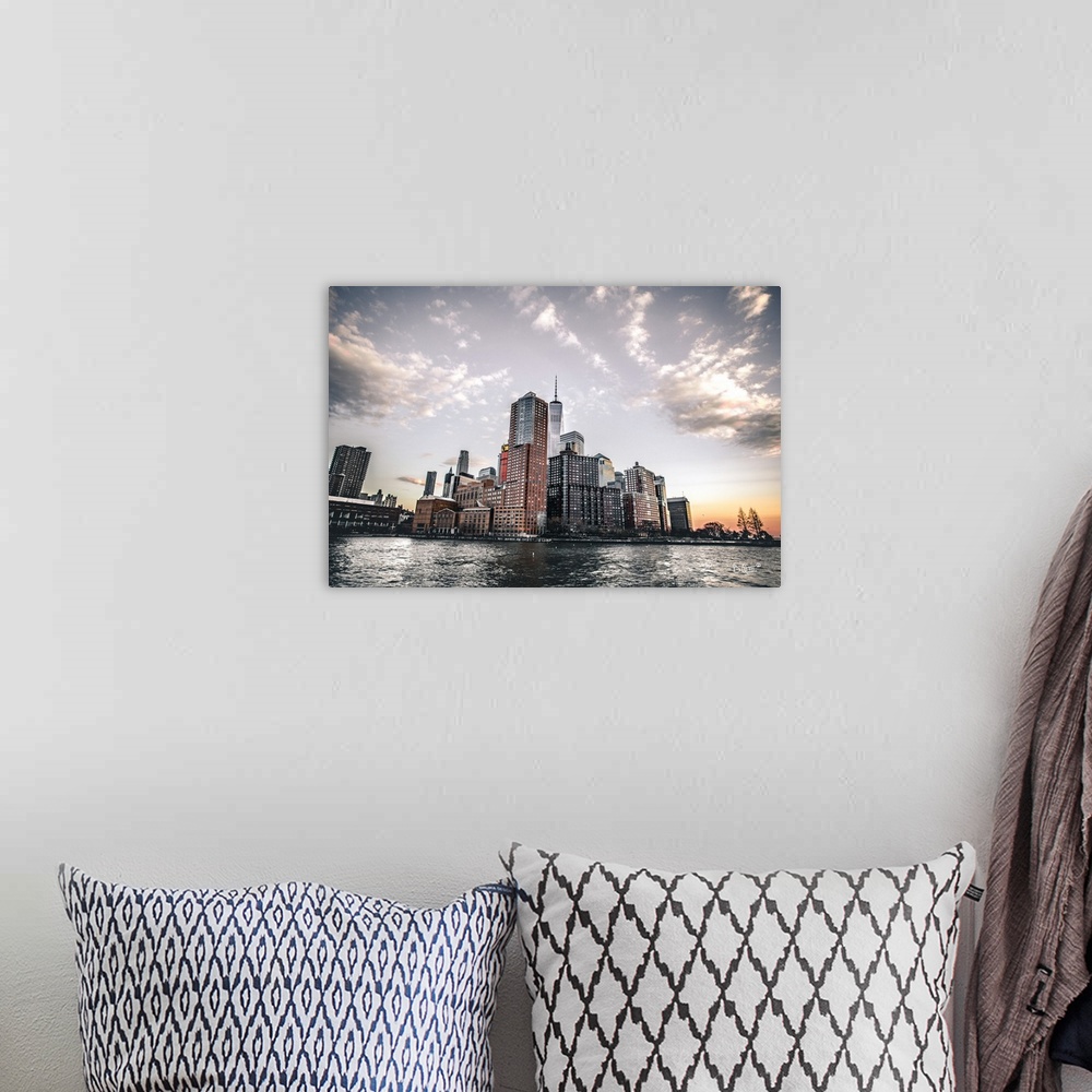 A bohemian room featuring Photograph of a city landscape.