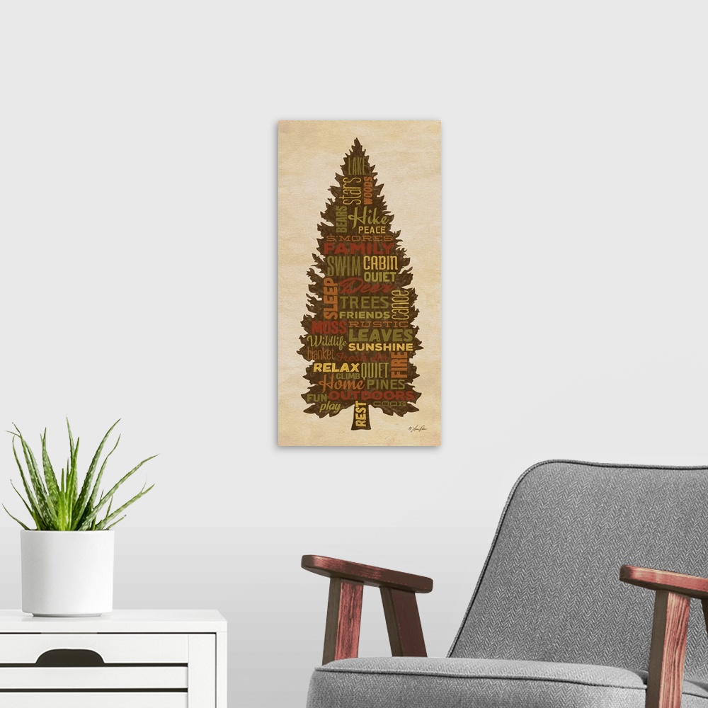 A modern room featuring Typography art of forest and lake lodge-themed words in the silhouette of a pine tree.