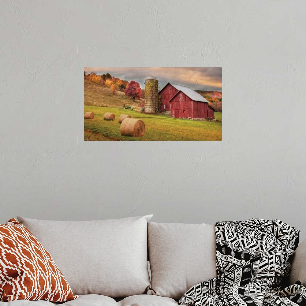 A bohemian room featuring Photograph of a red barn in rural countryside scene.